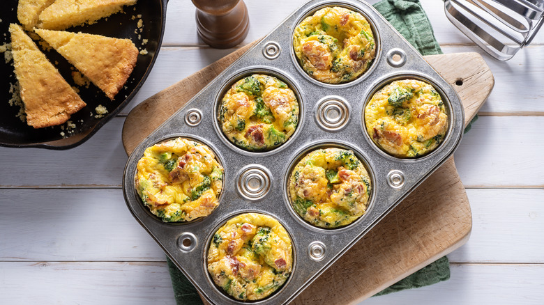 Egg, cheese, and broccoli cups in a muffin tin