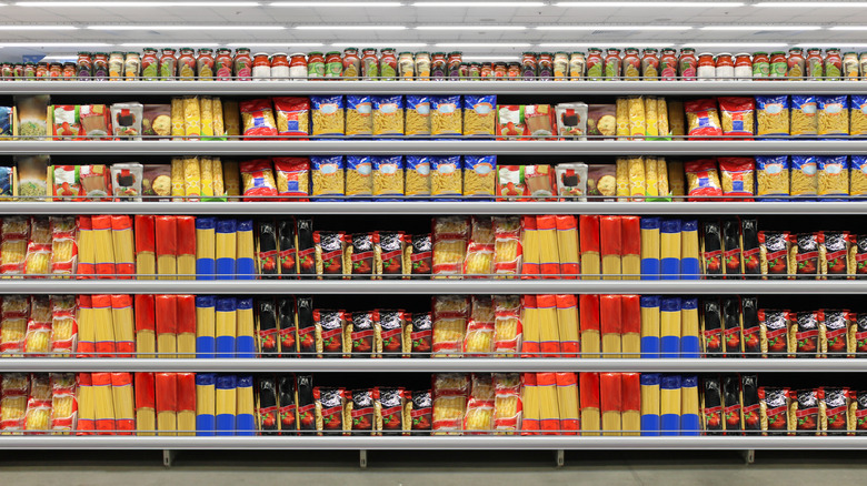 Different types and brands of pasta on a supermarket shelf