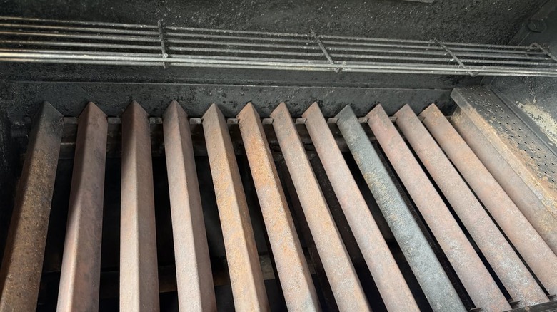 Dirty, rusty flavorizer bars on a Weber grill