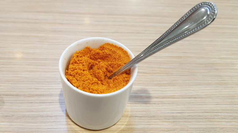 A bowl of red seasoning similar to Taco Bell's version