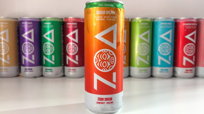 Can of Mango Splash ZOA energy drink on white table, other cans behind