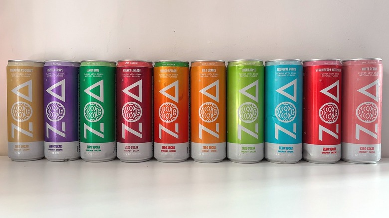10 cans of ZOA energy drink lined up on white table
